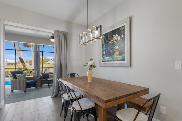 dining space with wood finished floors and a ceiling fan