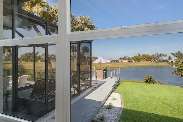 doorway to outside featuring a water view