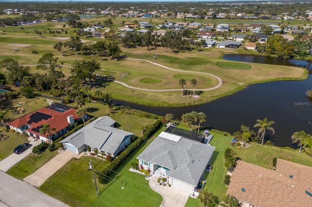 aerial view featuring golf course view, a water view, and a residential view