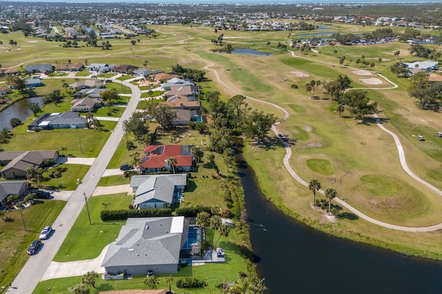 aerial view featuring a residential view, view of golf course, and a water view