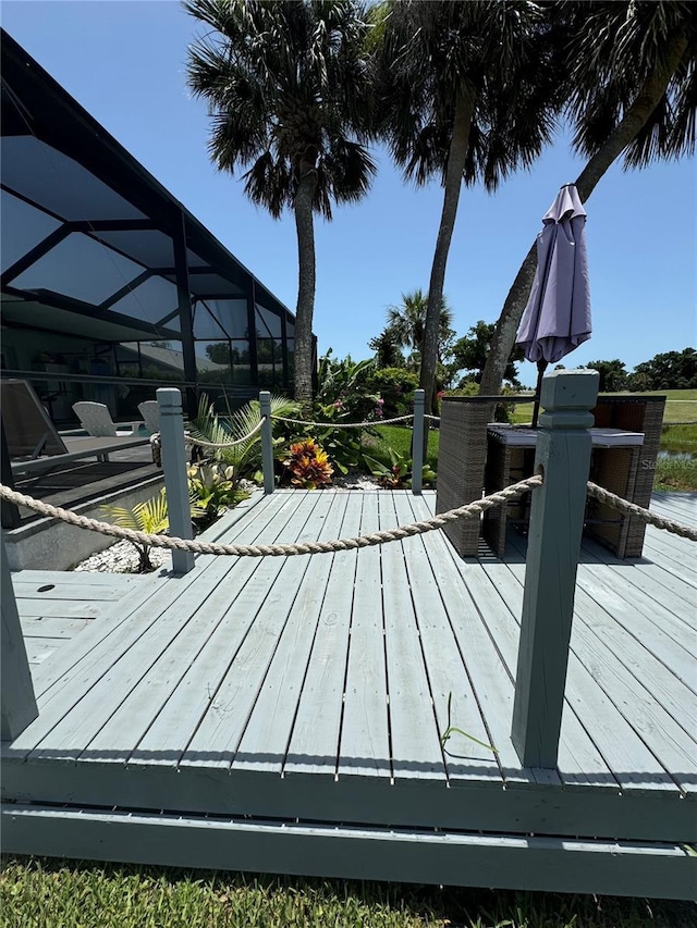 6 Bunker Cir, Rotonda West, FL 33947 - wooden deck featuring a lanai