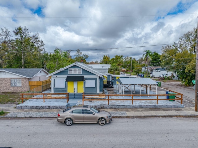 bungalow featuring a fenced front yard