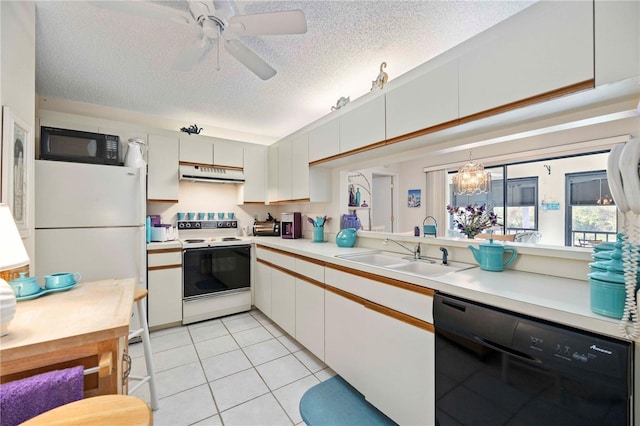 kitchen with light countertops, range hood, light tile patterned flooring, black appliances, and a sink