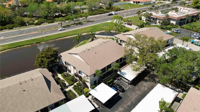 birds eye view of property with a water view and a residential view