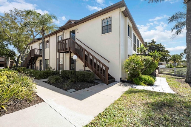 exterior space featuring stairway and fence