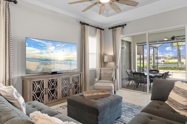 tiled living area featuring a ceiling fan, a sunroom, and crown molding