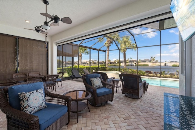 view of patio with glass enclosure, ceiling fan, and outdoor lounge area