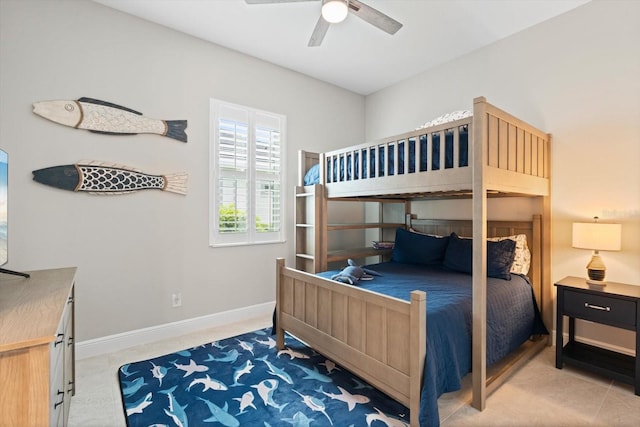 bedroom with a ceiling fan, light colored carpet, and baseboards