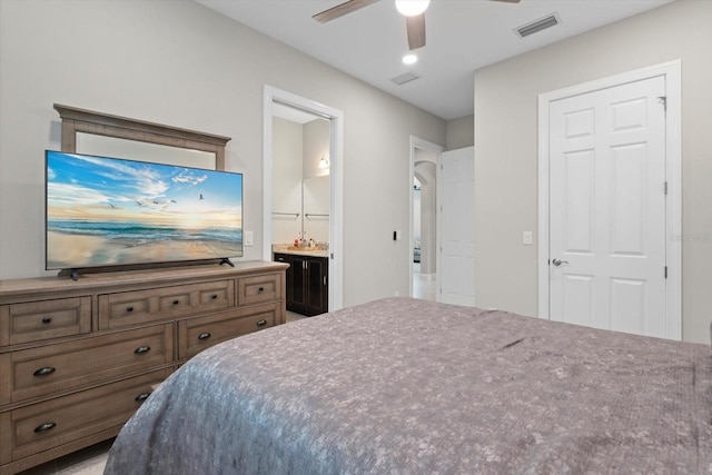 bedroom with ceiling fan, ensuite bath, and visible vents