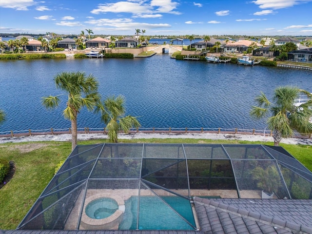 aerial view featuring a water view and a residential view