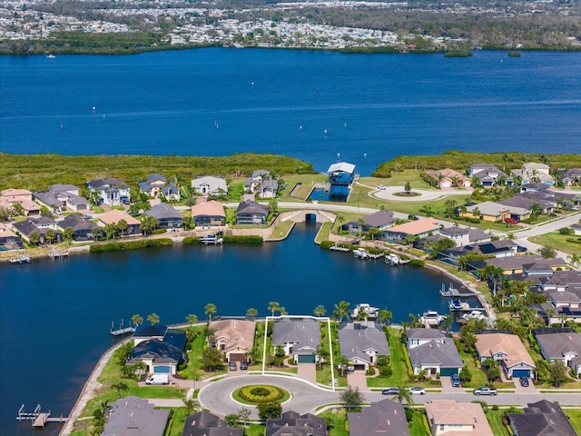 birds eye view of property with a water view and a residential view