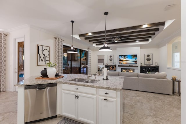 kitchen featuring light stone countertops, a lit fireplace, beam ceiling, stainless steel dishwasher, and a sink