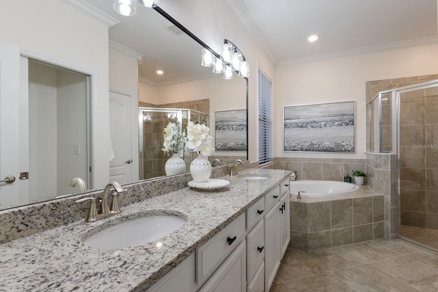 bathroom featuring crown molding, a stall shower, a sink, and a bath