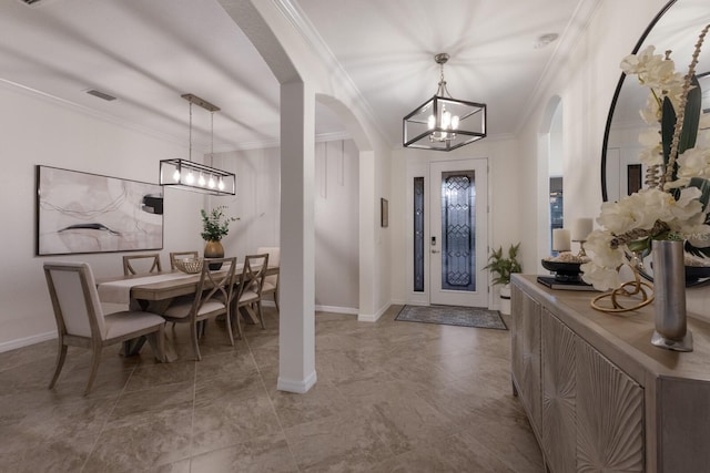 entrance foyer with arched walkways, a notable chandelier, visible vents, and crown molding