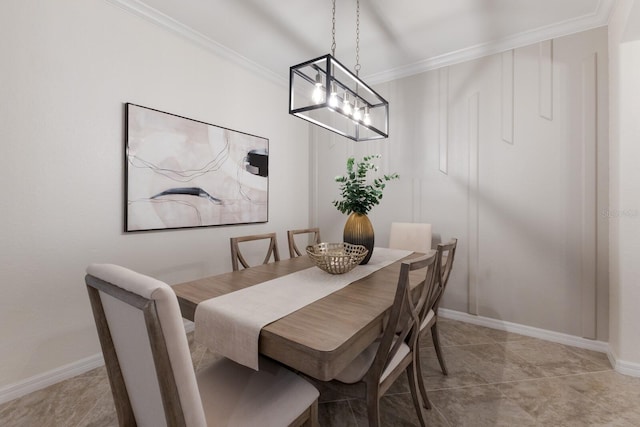 dining room with crown molding and baseboards