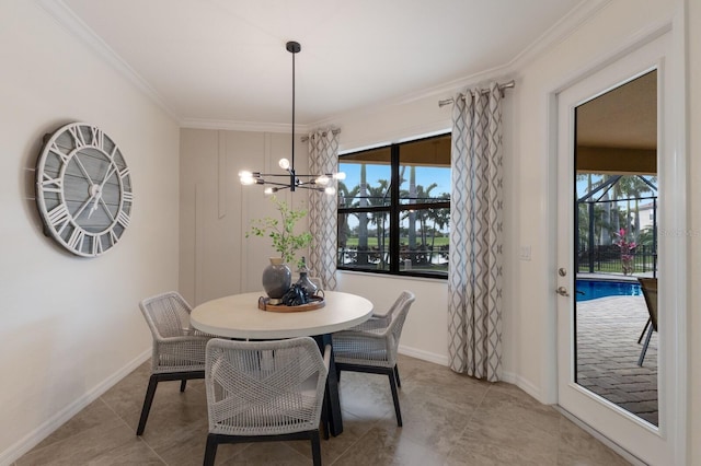 dining space featuring a notable chandelier, crown molding, baseboards, and a wealth of natural light