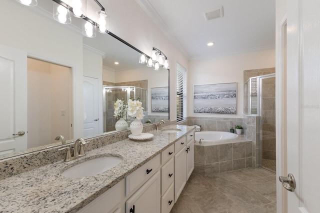 bathroom featuring a stall shower, visible vents, ornamental molding, and a sink