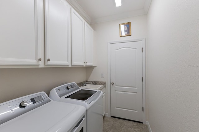 laundry area featuring light tile patterned floors, separate washer and dryer, a sink, cabinet space, and crown molding