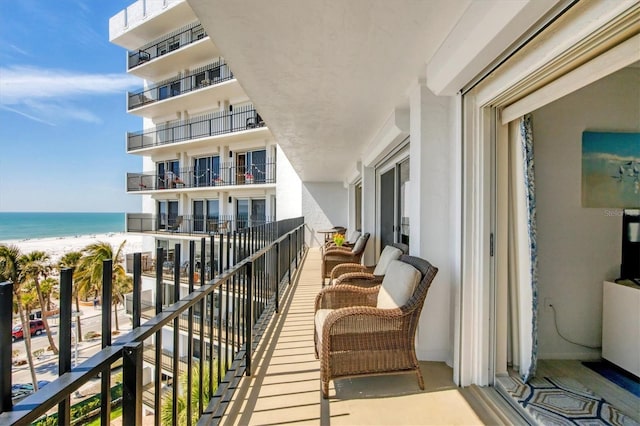 balcony with a view of the beach and a water view