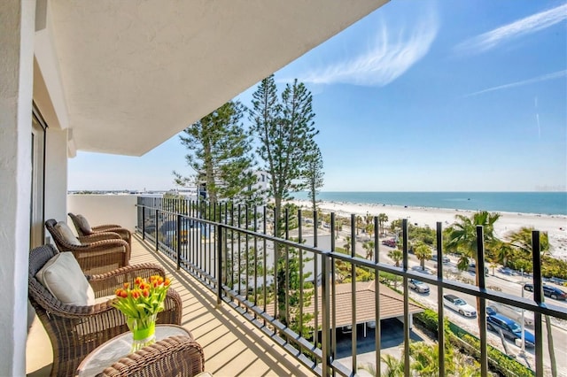 balcony with a view of the beach and a water view