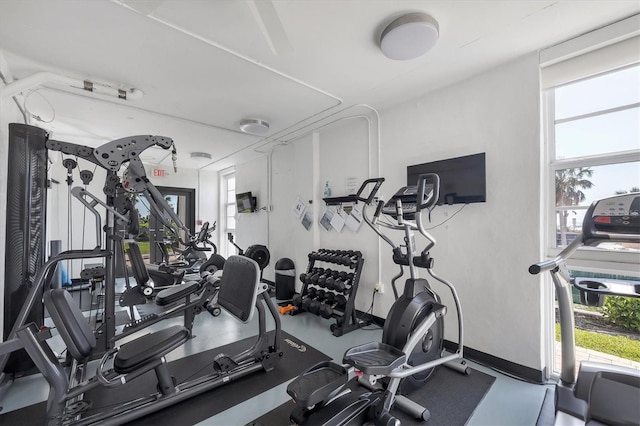 workout area featuring baseboards