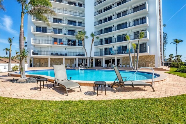 community pool with a patio area