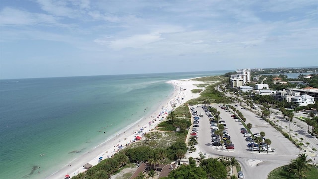 aerial view featuring a water view and a beach view