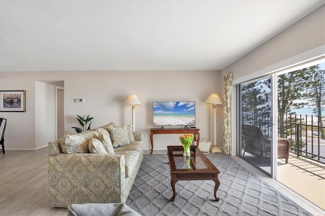 living area featuring baseboards