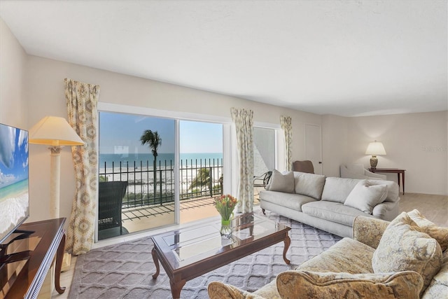 living area featuring a water view