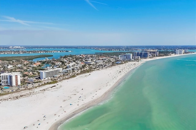 birds eye view of property featuring a view of the beach, a view of city, and a water view