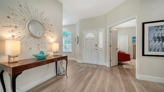 entryway with light wood-style floors and baseboards