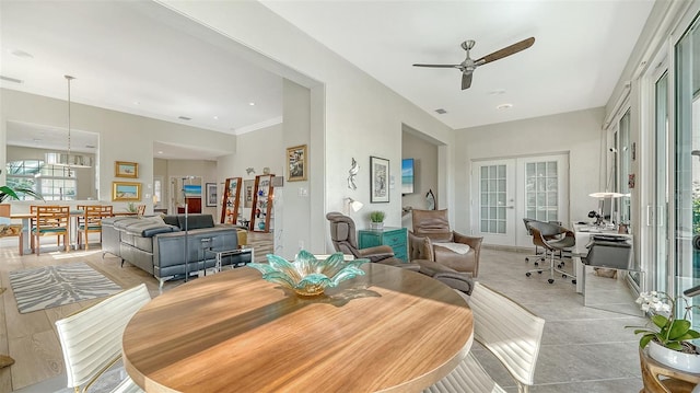 dining room with ceiling fan, visible vents, baseboards, and french doors