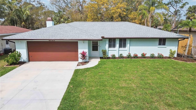 ranch-style house featuring a garage, cooling unit, a chimney, and a front lawn