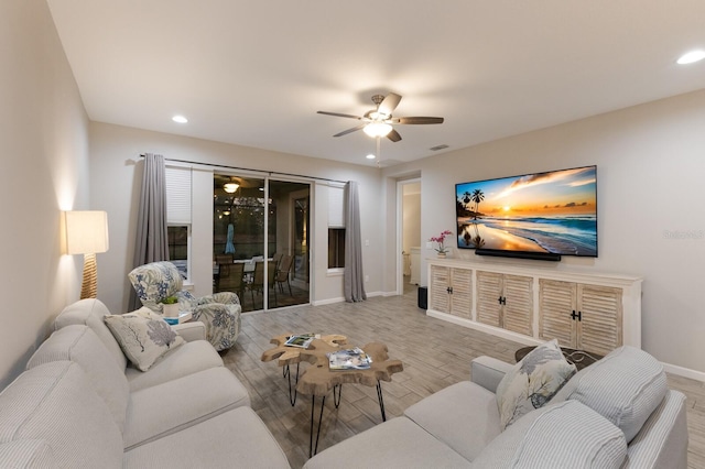 living area with recessed lighting, ceiling fan, baseboards, and wood finished floors