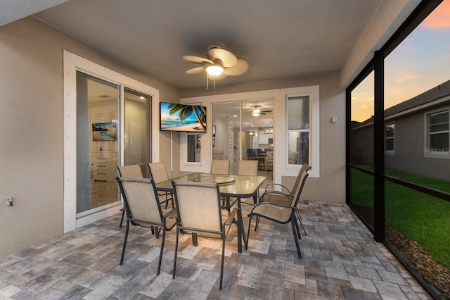 sunroom / solarium with ceiling fan