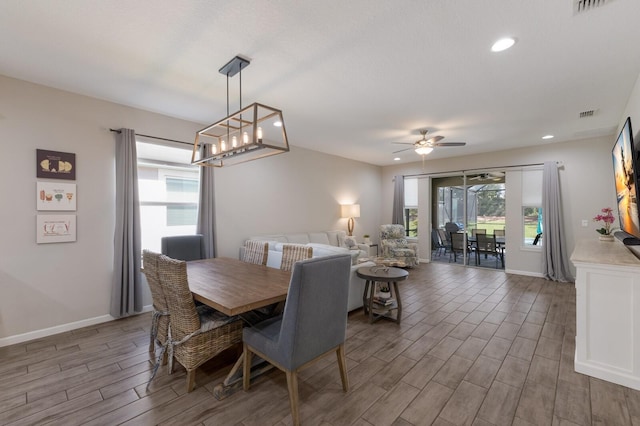 dining space with wood finish floors, ceiling fan, baseboards, and recessed lighting