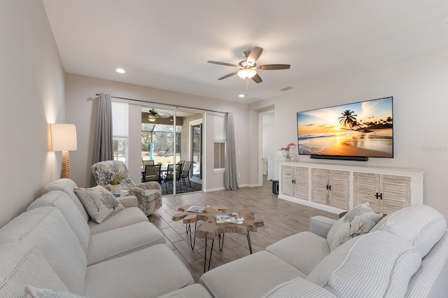 living room featuring baseboards, visible vents, ceiling fan, wood finished floors, and recessed lighting