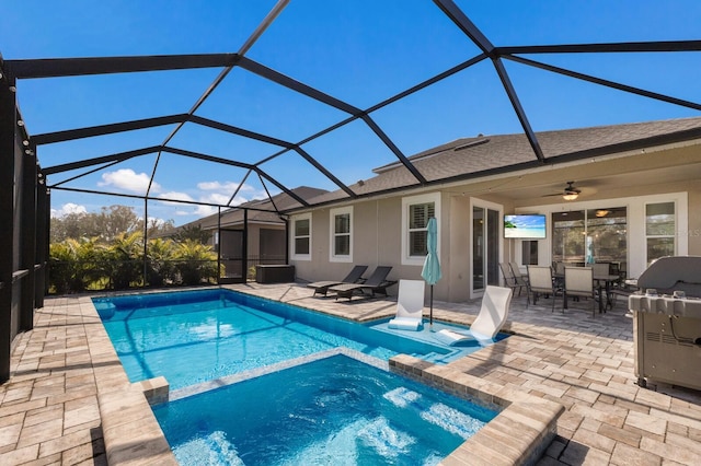 view of swimming pool with glass enclosure, a patio area, a grill, and a pool with connected hot tub