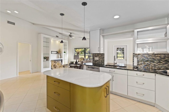 kitchen with a center island, visible vents, a sink, and open shelves