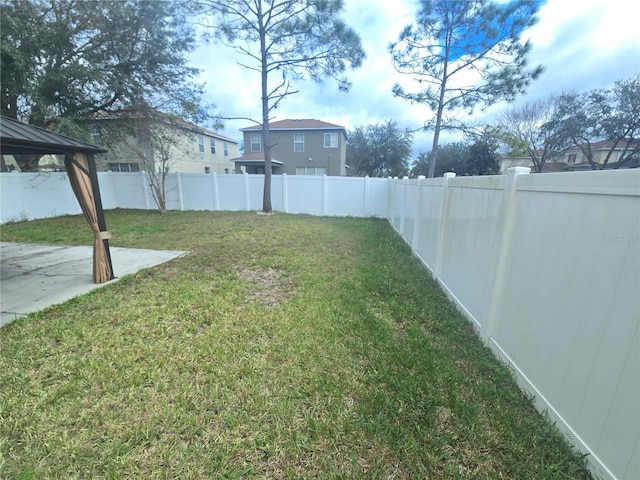 view of yard with a gazebo, a patio, and a fenced backyard