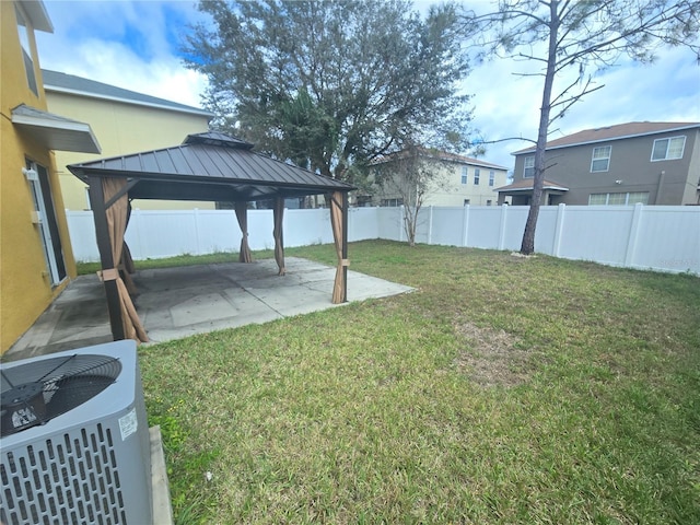 view of yard with a gazebo, central AC, a patio, and a fenced backyard