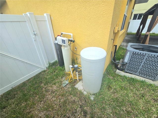 details with cooling unit and stucco siding