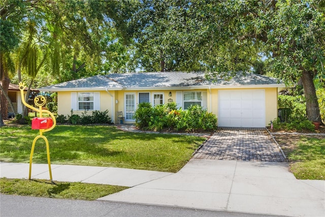 ranch-style home featuring a garage, a front lawn, decorative driveway, and stucco siding