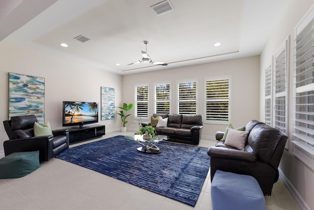 tiled living area with recessed lighting, visible vents, and baseboards