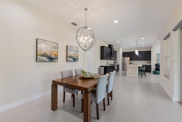 dining room featuring recessed lighting, visible vents, baseboards, and an inviting chandelier