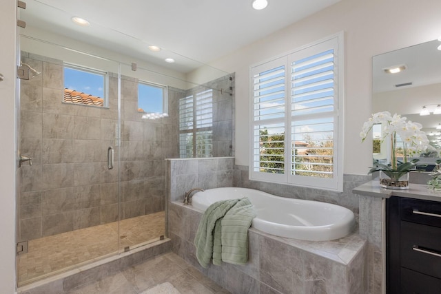 full bathroom featuring tile patterned flooring, recessed lighting, vanity, a bath, and a stall shower