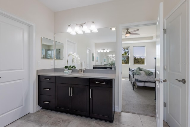 full bathroom with a ceiling fan, connected bathroom, vanity, and tile patterned floors