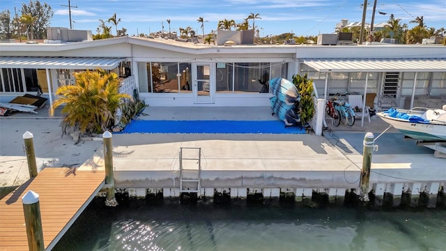 back of house featuring a water view