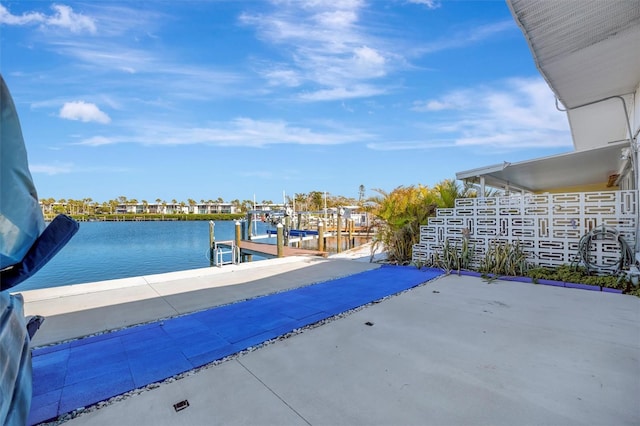 exterior space with a water view and boat lift