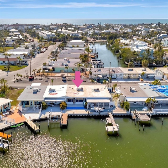 aerial view with a residential view and a water view